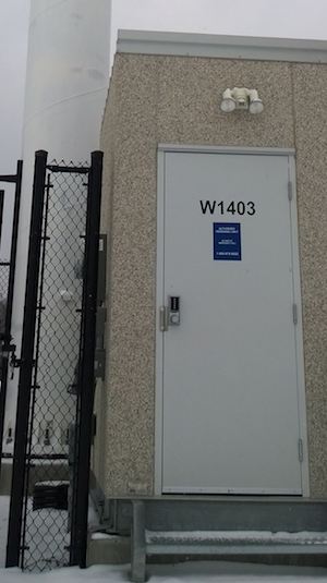Bell site W1403 site code shown on door
