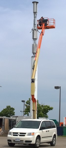 Technician installing antennas at site W4925